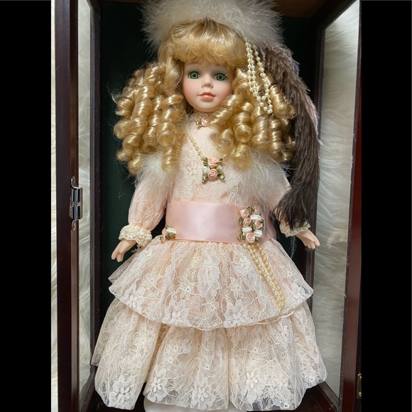 porcelain doll in wooden box